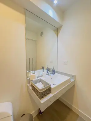 a bathroom with two sinks and a large mirror at APPARTEMENT CHIC MIRAFLORES Paradis in Lima
