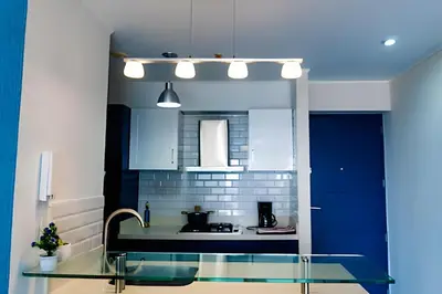 a kitchen with a glass table and a sink at Apartment in the most touristy area of Miraflores in Lima