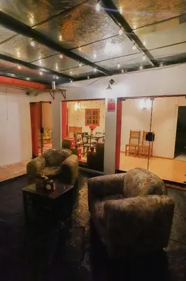 a living room with two couches and a table at CHARMING AND QUIET apart IN CUSCO in Cusco