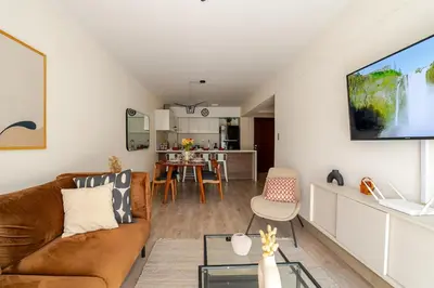 a living room with a couch and a table at Cozy apartment by Parque Kennedy, Miraflores in Lima