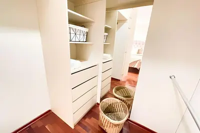 a small room with white cabinets and baskets at Cosy place retreat Miraflores 3BR in Lima