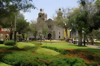 a view of a building with a green yard at Cosy place retreat Miraflores 3BR in Lima