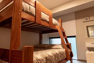 a bunk bed in a room with a bunk bed in a house at Hermoso departamento de estreno in Lima