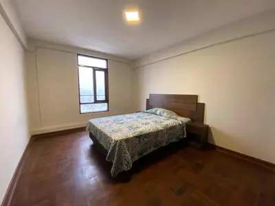a bedroom with a bed and a window at Elegant and spacious penthouse in Lima