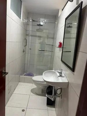 a bathroom with a toilet and a sink and a shower at Casa de Stephano in Lima