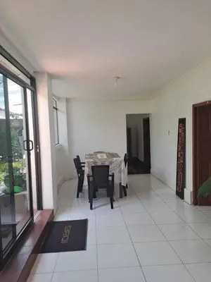 a dining room with a table and chairs in a room at Casa Jardin in Ayacucho