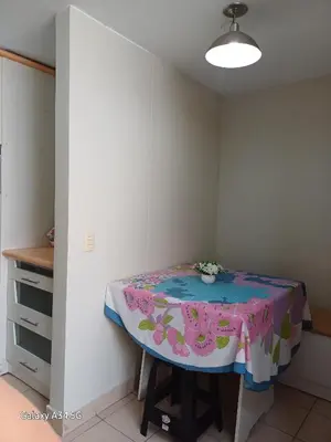 a room with a table with a table cloth on it at Cómodo departamento familiar in Lima
