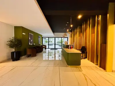 a lobby with a reception desk in a building at Modern and centrally located with a rooftop in Lima