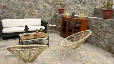 a living room with two chairs and a couch at Casa campo vista linda in Mala