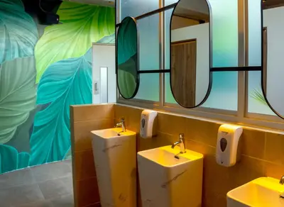 a bathroom with two sinks and two mirrors at Senoma Hotel - Adults only in Ica