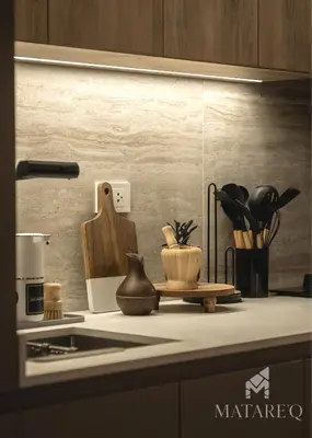 a kitchen counter with a counter top with a stove and a counter top at Luxury apartment steps from Plaza de Armas in Cusco