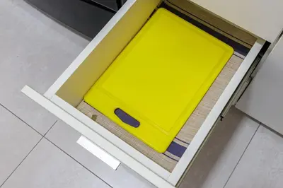 a yellow drawer in a kitchen cabinet with a floor at BSR Flat los Andes near Airport in Lima