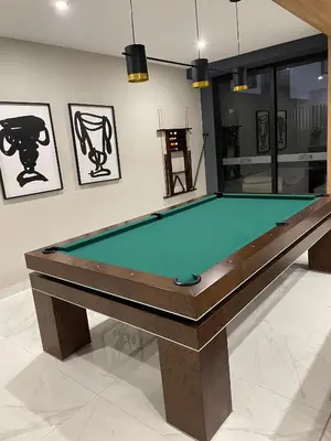 a pool table in a room with paintings on the wall at Moderno y Exclusivo Apartamento situado en Barranco in Lima