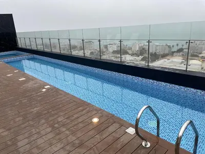 a swimming pool on the top of a building at Moderno y Exclusivo Apartamento situado en Barranco in Lima