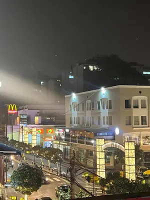 a view of a city at night with a building at Monterrico Polo Aparts 19 - Dpto de Estreno con Balcon frente Embajada USA in Lima