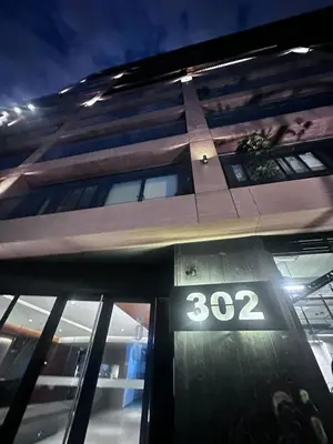 a building with the number on the front at e-t*| Apartamento vista espectacular in Lima