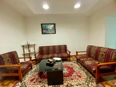a living room with two couches and a table at Guadita House in Cusco