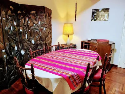 a bedroom with a bed with a colorful blanket on it at Entire Apartment in Miraflores in Lima