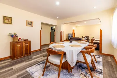 a dining room with a table and chairs at Intiflatscusco Comfortable Stay in the Heart of the City in Cusco