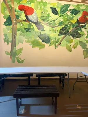 a painting of two birds sitting on a tree at Lima Hostel - Barranco in Lima