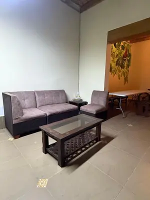 a living room with a couch and a coffee table at Lima Hostel - Barranco in Lima