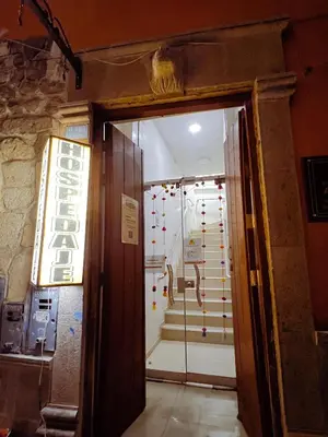 an open door to a room with a shower at Huamanga plaza in Ayacucho