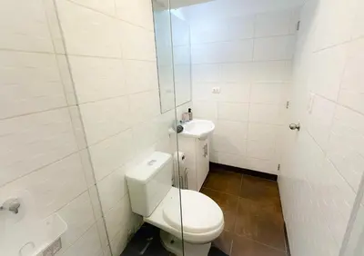 a small bathroom with a toilet and a sink at Exclusivo con vista al mar - Blue Ocean in Lima