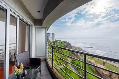 a balcony with a view of the ocean at BSR Oceanview Family Flat w/ Parking in Lima