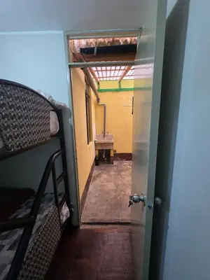 an open door to a room with a bunk bed at RODRICH apartment 2 in Lima