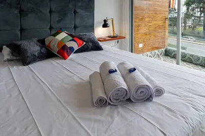 a group of rolled up towels on a bed at BSR Romantic Escape Flat w/ Rooftop Pool in Lima