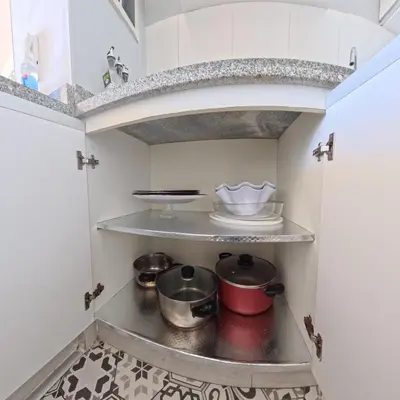 a kitchen with white cabinets and pots and pans at Ocean Blue, Vista Frontal Al Mar in Lima