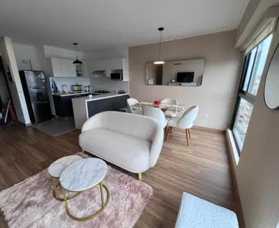 a living room with a couch and a table at APARTMENT NEW COMFORTABLE in MIRAFLORES in Lima