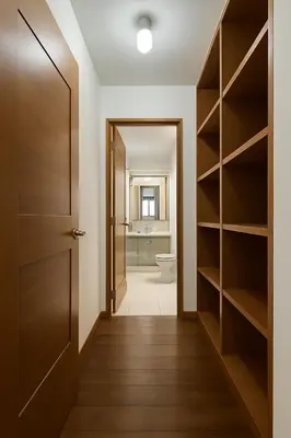 a hallway with a bathroom with a toilet and a door at E LarcomarZone Sea View All Inclusive 3B 701 in Lima
