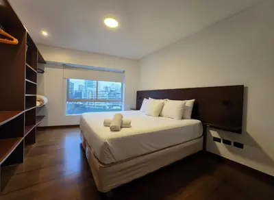a bedroom with a large bed and a window at E LarcomarZone Sea View All Inclusive 3B 701 in Lima