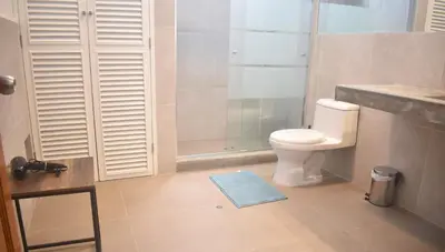 a bathroom with a toilet and a shower at MirandoelMar - Luna in Lima