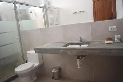 a bathroom with a sink and a toilet at MirandoelMar - Luna in Lima