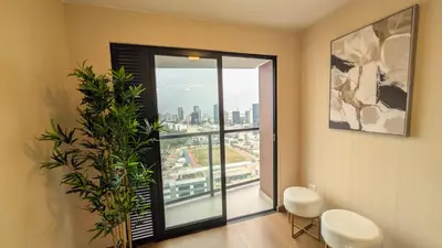 a room with a window with a view of the city at Descanso en Oscuridad Absoluta in Lima