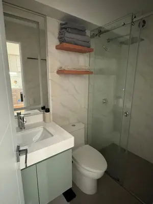 a bathroom with a toilet and a sink and a shower at Miraflores La Mar in Lima