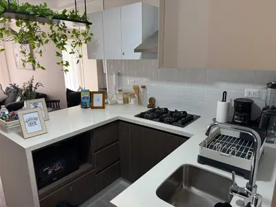 a kitchen with a sink and a stove at Art10 Milu - Miraflores-Larcomar in Lima