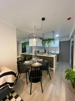 a kitchen and dining room with a table and chairs at Art10 Milu - Miraflores-Larcomar in Lima
