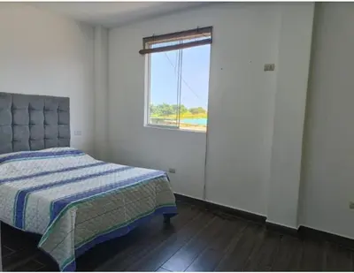 a bedroom with a bed and a window at Casa En Asia in San Antonio
