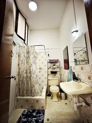 a bathroom with a toilet and a sink at Mini Apartamento BARRANCO in Lima