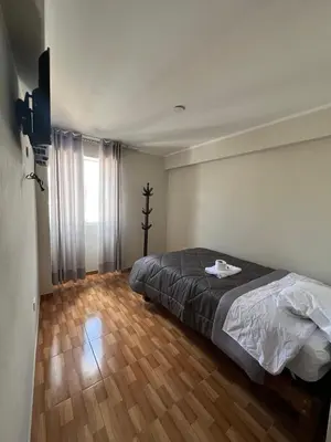 a bedroom with a bed and a wooden floor at Don Rafael - Hotel
