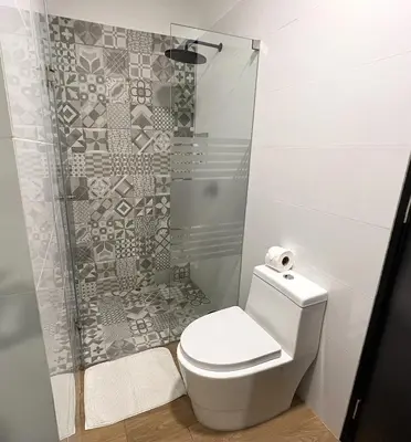 a bathroom with a toilet and a shower at 1 Bedroom Apartment San Isidro Business Zone in Lima