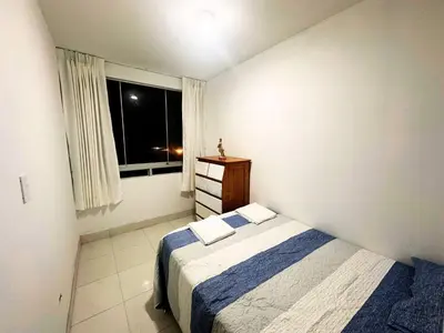 a small bedroom with a bed and a window at RELAX Y PISCINA con vista al MAR - DUPLEX in Cerro Azul