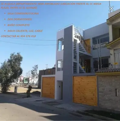 a building with a staircase on the side of it at Casa Hamuys - Ica in Ica