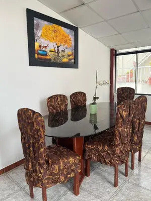 a dining room with a table and chairs at Allyu Wasi-Chanka in Andahuaylas