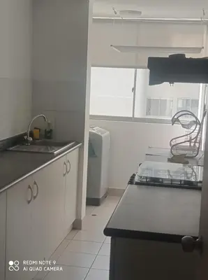 a kitchen with a sink and a counter top at Cozy Furnished Brand New Apartment