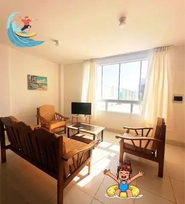 a living room with a boy on a surfboard on the floor at RELAX Y PISCINA con vista al MAR - FLAT in Cerro Azul