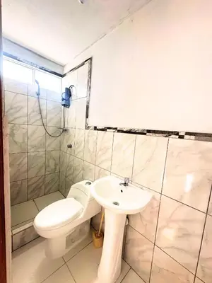 a bathroom with a toilet and a sink at RELAX Y PISCINA con vista al MAR - FLAT in Cerro Azul